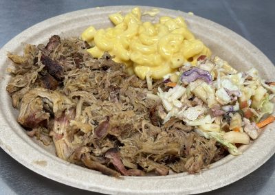 pulled pork plate with coleslaw and macaroni and cheese