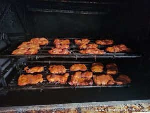 whole chickens being smoked